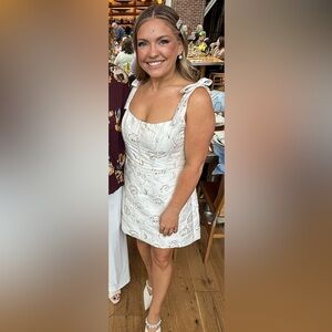 BOW-STRAP IVORY GOLD ROSETTE BUSTIER MINI DRESS IN IVORY GOLD ROSETTE